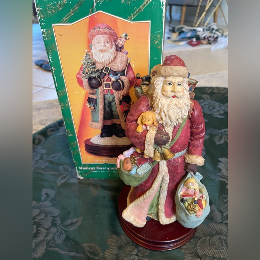Tall Santa with music. Wood base